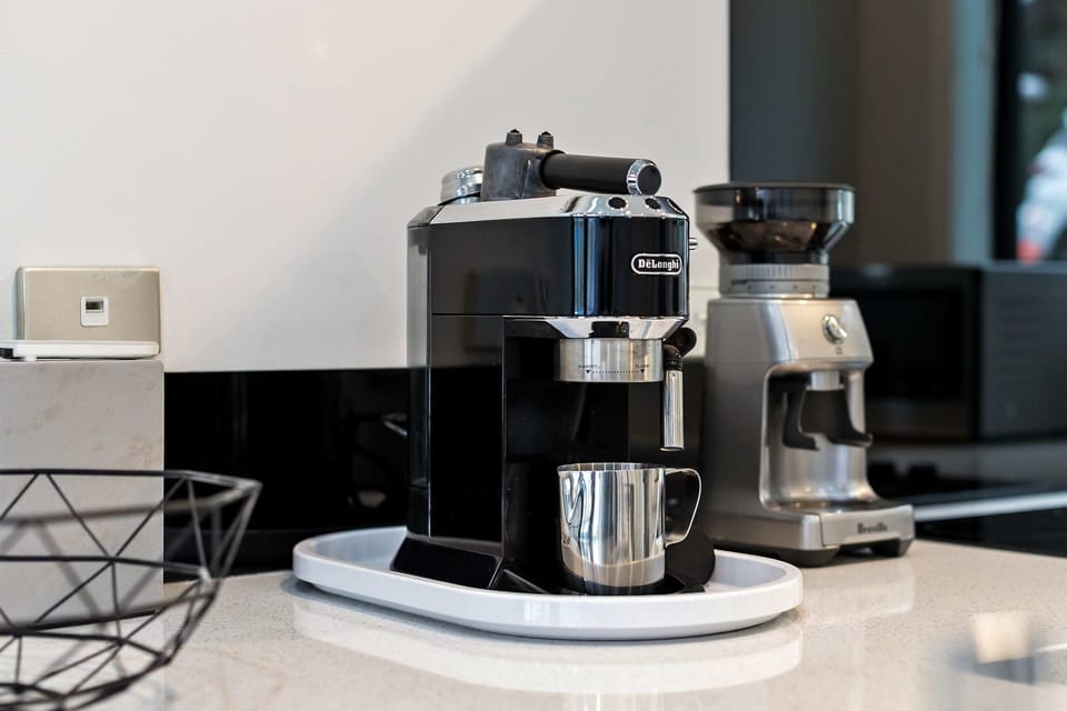 Kitchen equipped with coffee machine and grinder