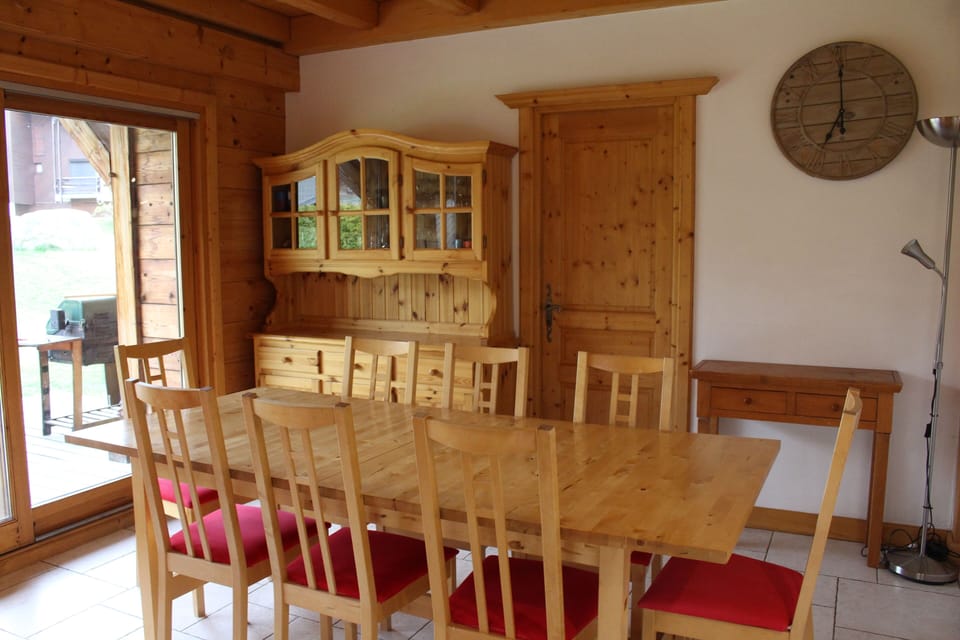 Dining area with table extending to happily seat up to 12 - south facing patio doors open on to terrace (bbq) and private garden.