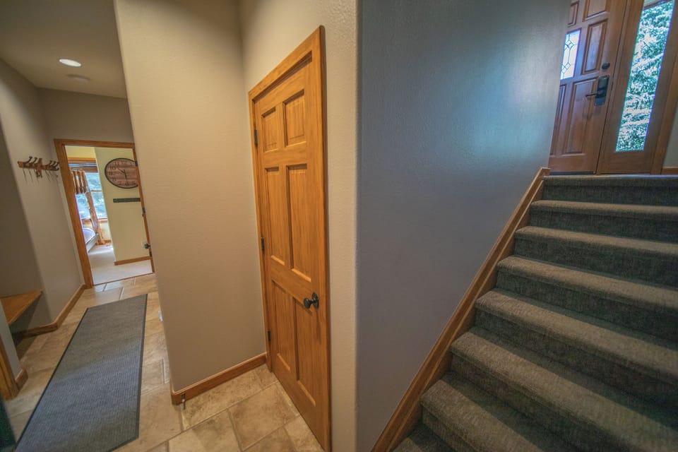 Hallway to downstairs bedrooms and game room!