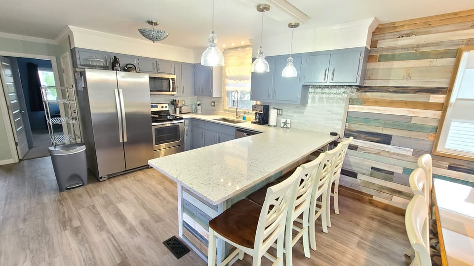 Quartz & recycled glass counters, deep 2 compartment Kraus sink & faucet