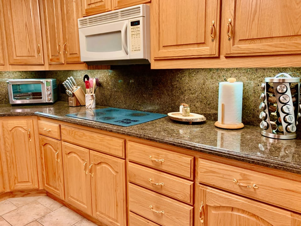 A spacious kitchen has plenty of room for you to cook delicious meals.