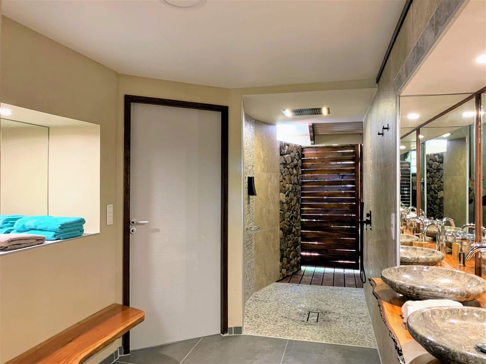 The very spacious shower area, with private access to the terrace