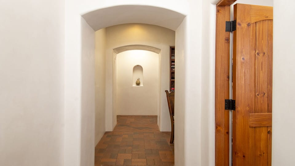 Hallway leads to office nook, laundry and 2 car garage