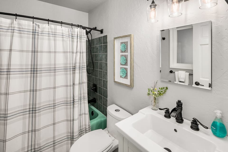 Bedroom 2 en suite bathroom with tub and shower