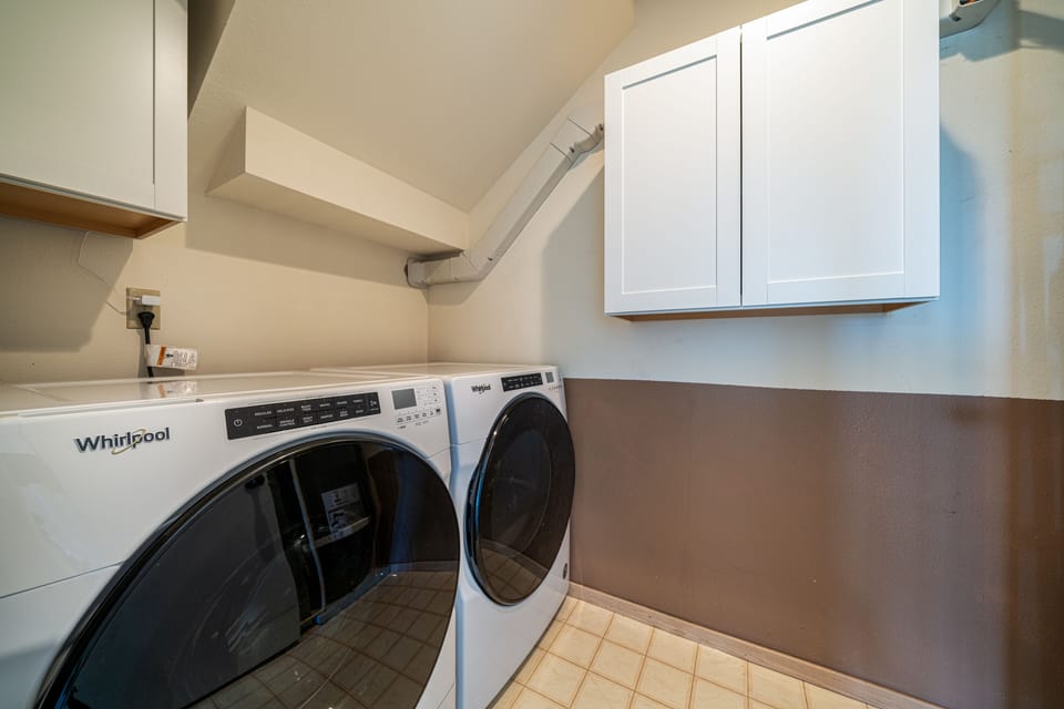 Lower Level Laundry Room with Full Size Washer and Dryer