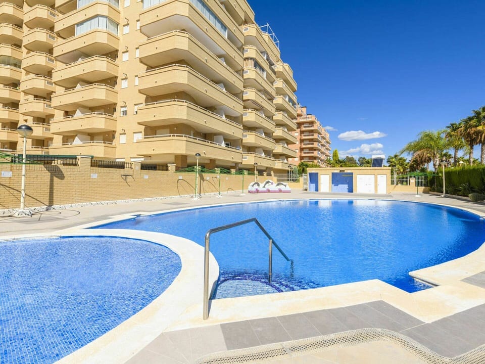 Water, Sky, Building, Property, Swimming Pool, Blue, Azure, Window, Outdoor Furniture, Tree