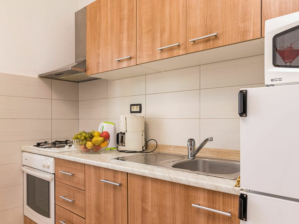 Cabinetry, Countertop, Kitchen, Property, Room, Furniture, Yellow, Cupboard, Interior Design, Drawer