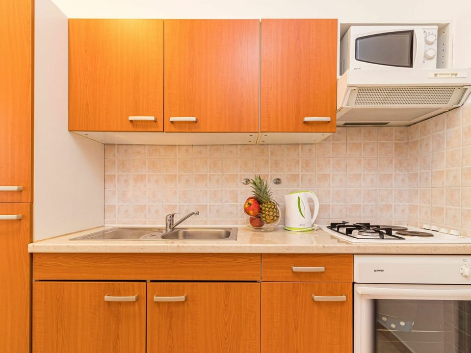 Countertop, Cabinetry, Kitchen, Room, Furniture, Property, Orange, Sink, Yellow, Interior Design