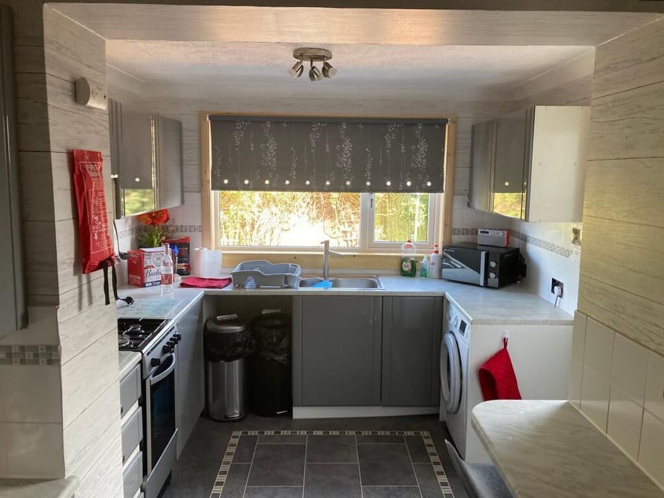 Nice bright kitchen. All the utensils to cook your meals  gas cooker,microwave oven, ninja airfryer, toaster, kettle, Tasimo coffee machine, dishwasher and washing machine 