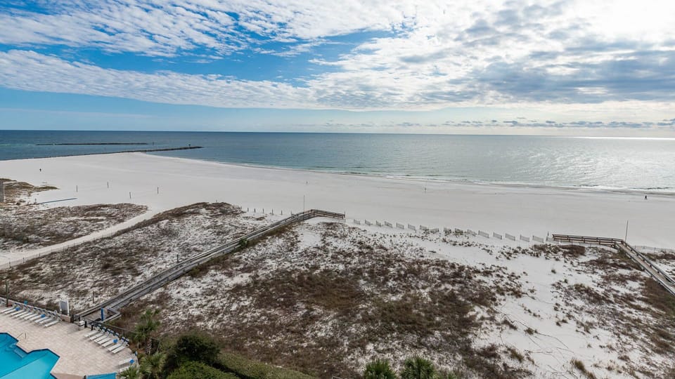 Enjoy stunning views of the shoreline and tranquil waters from your spacious outdoor area, perfect for relaxation