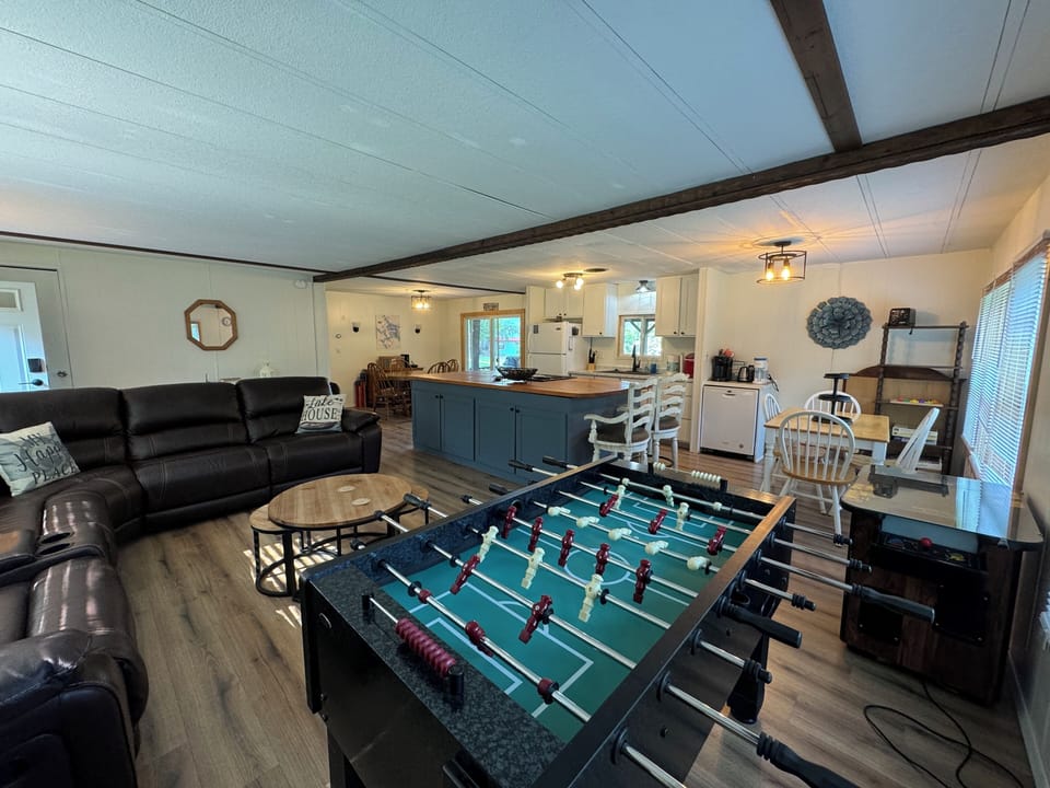 Foosball table and vintage Pac Man game for guests use. 