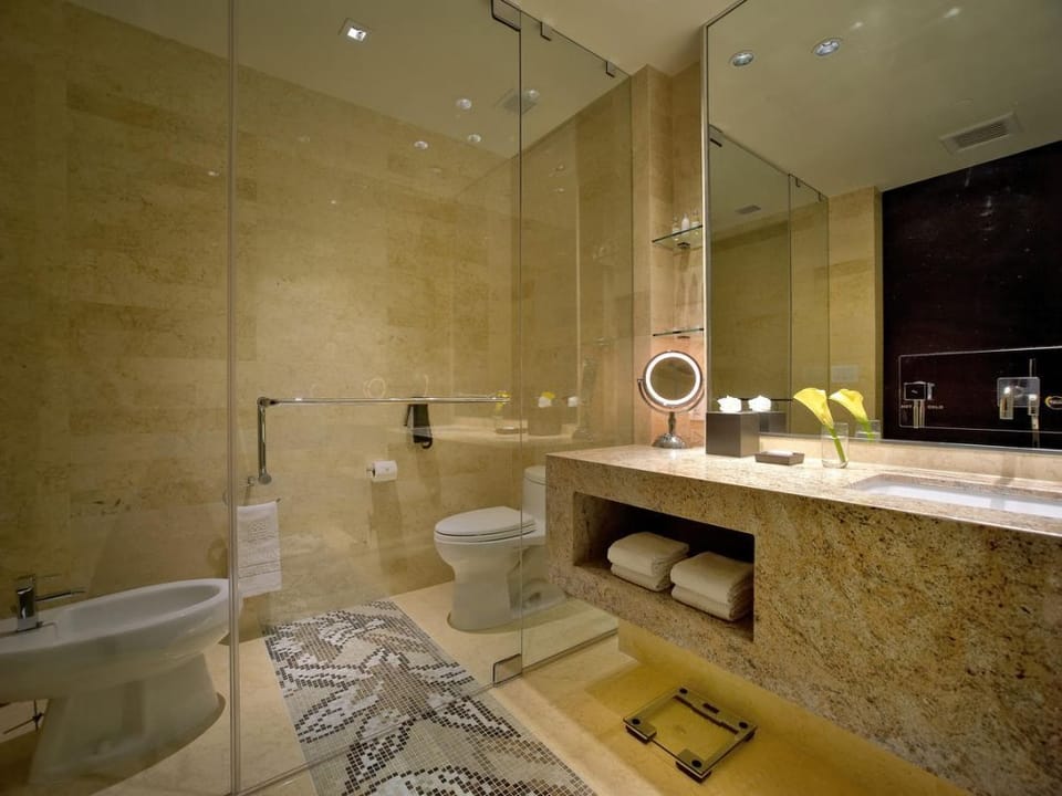 Refresh in a spa-like marble bath with soft lighting.