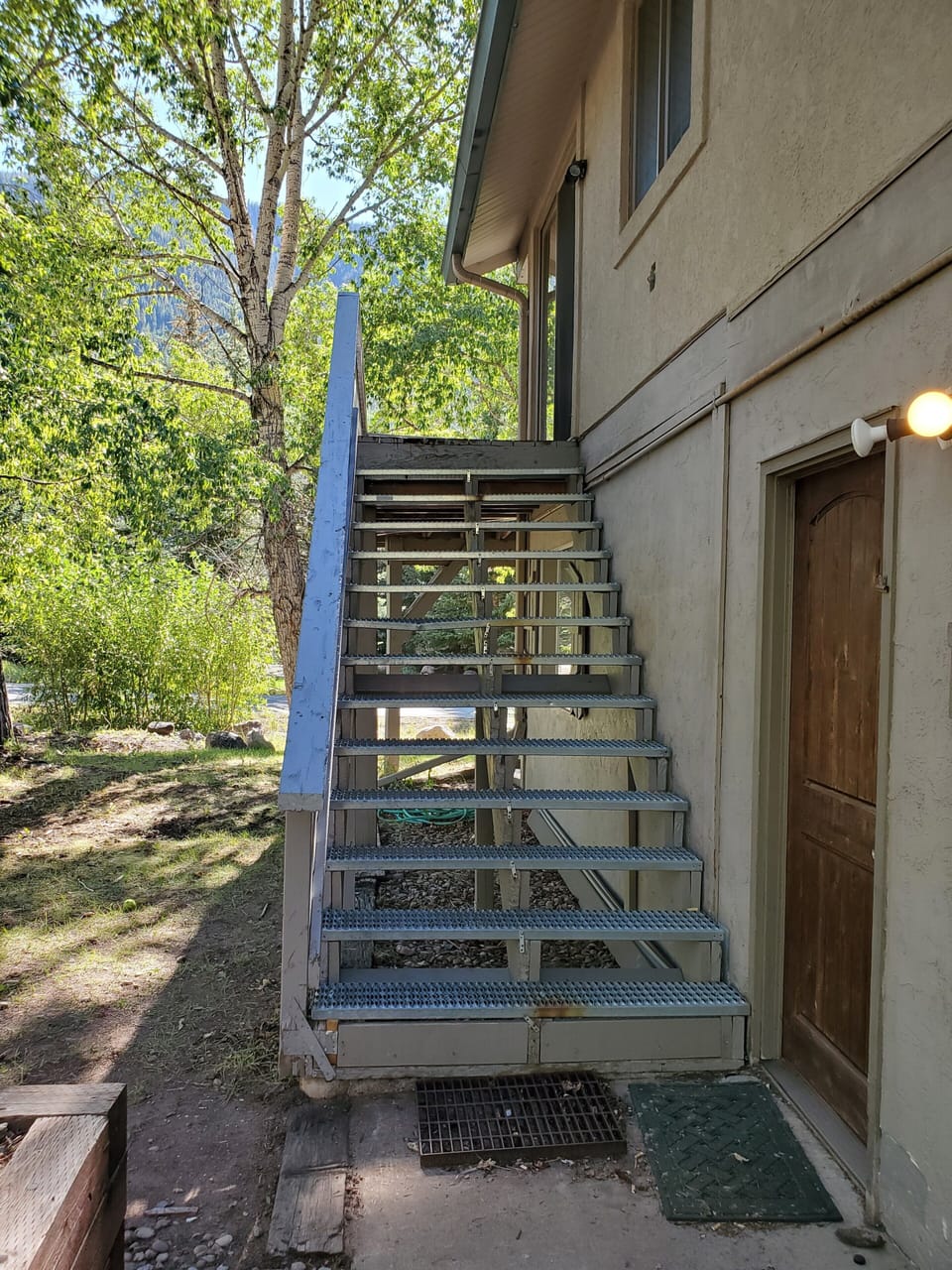 Stairs to deck and outside access to home