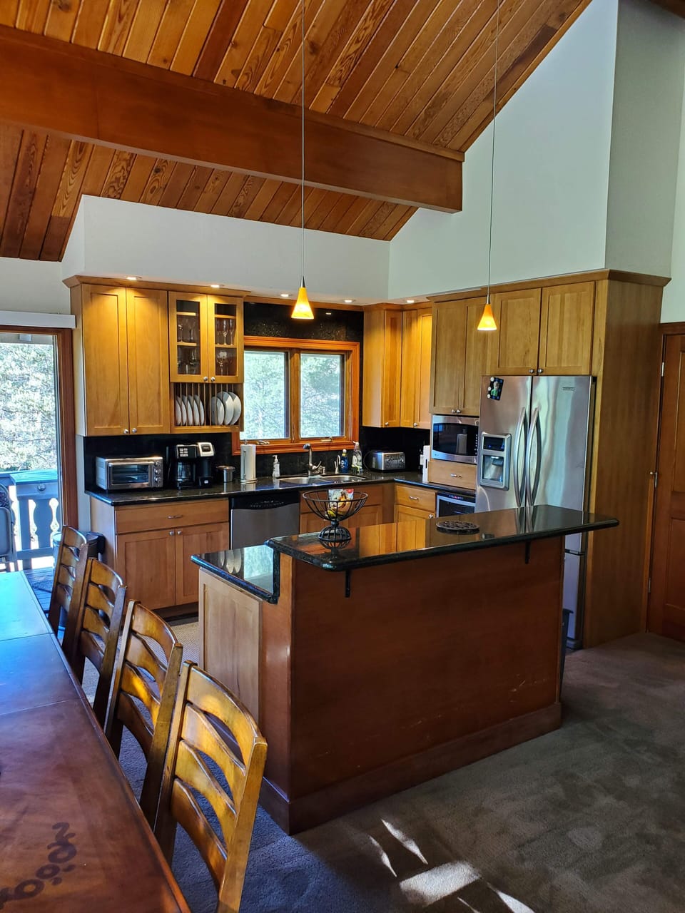 Kitchen with eat-in countertop and seating for three