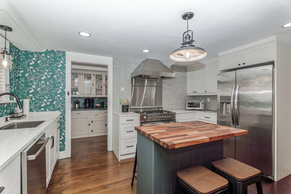 kitchen with view into the butler's pantry