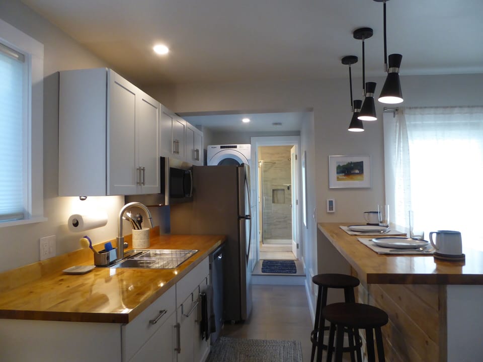 Galley kitchen with eat-in bar
