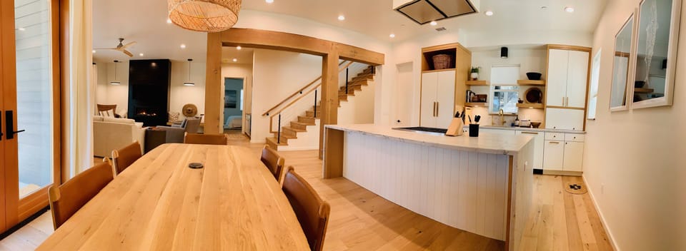 Kitchen and Dining room and stairway to the 3 upstairs bdr.  Master downstairs