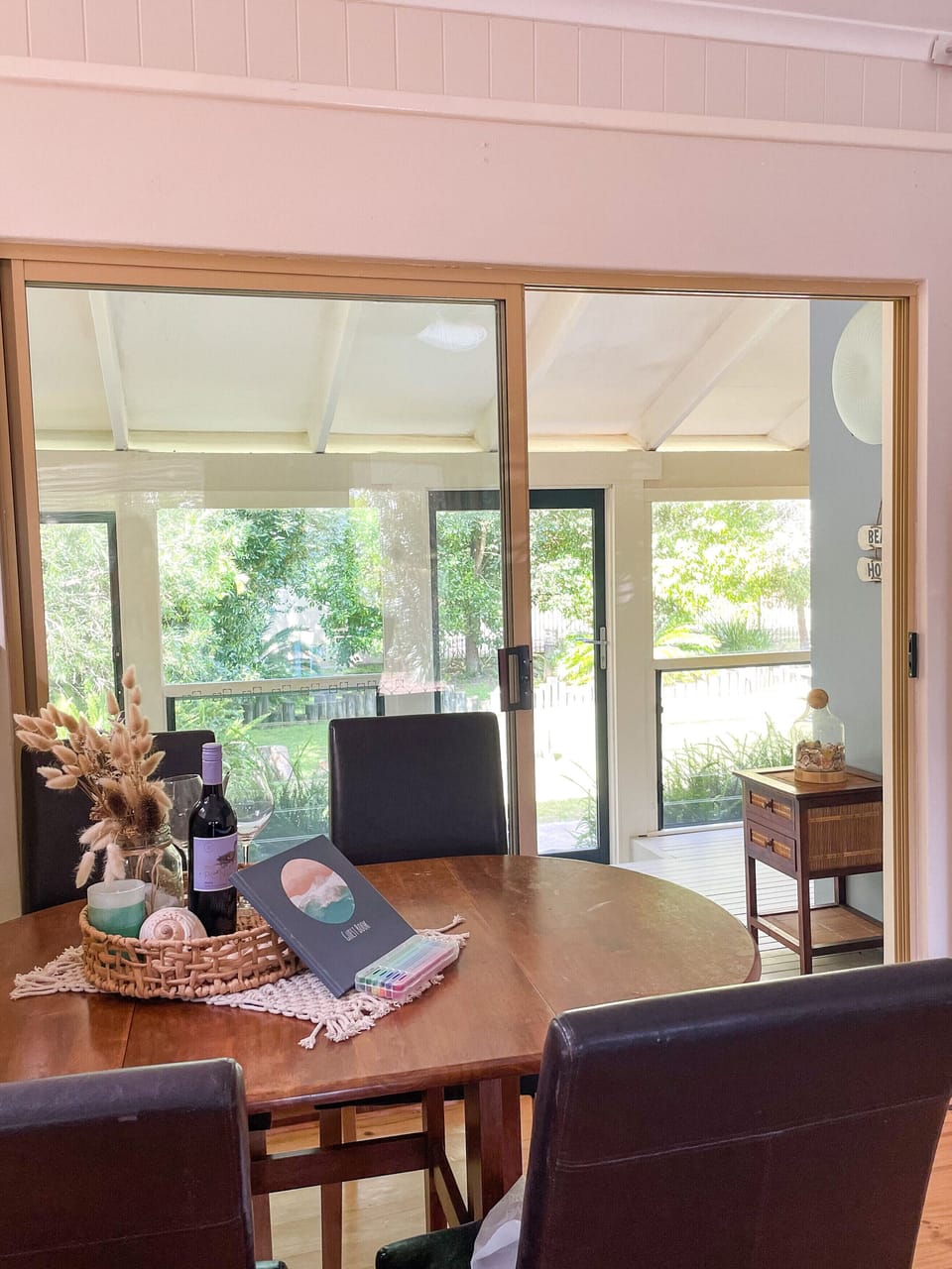 Dining table with views to the lush garden and Murramarang National Park