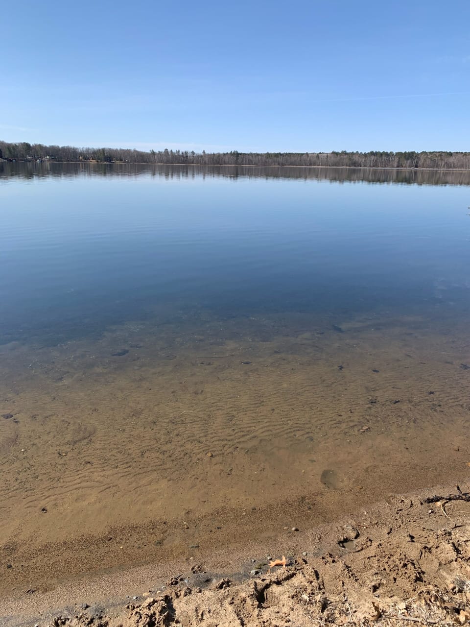 Clear, clean and calm  water with sandy bottom (Photo after ice out 4/1/21) 