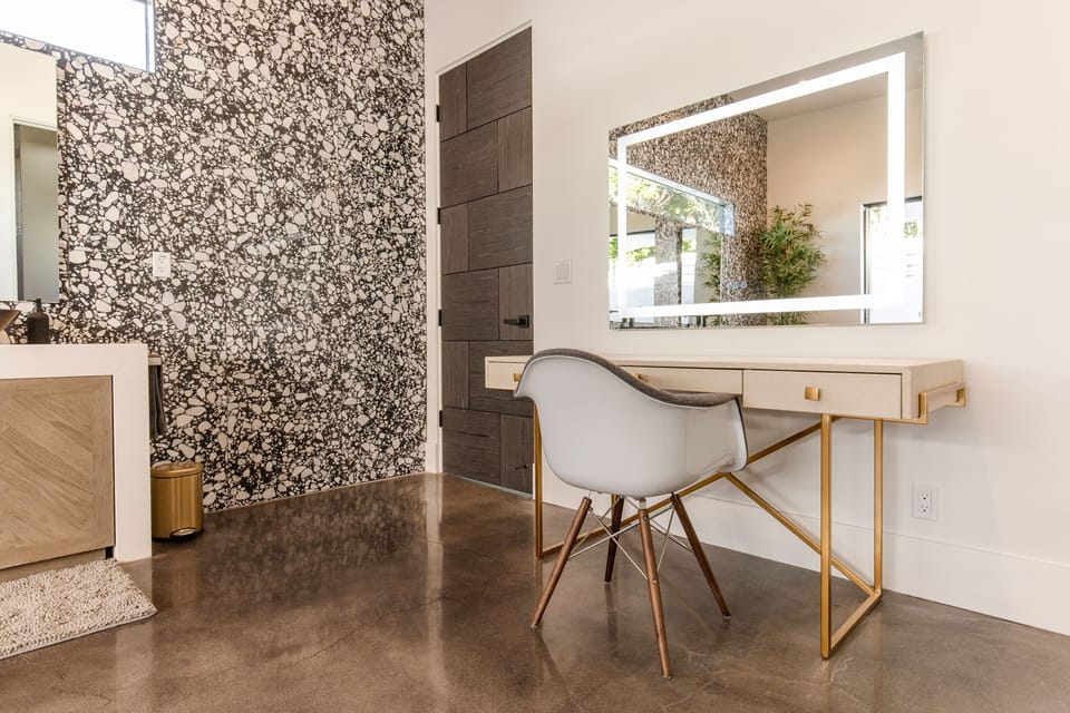 Makeup vanity with lighted mirror