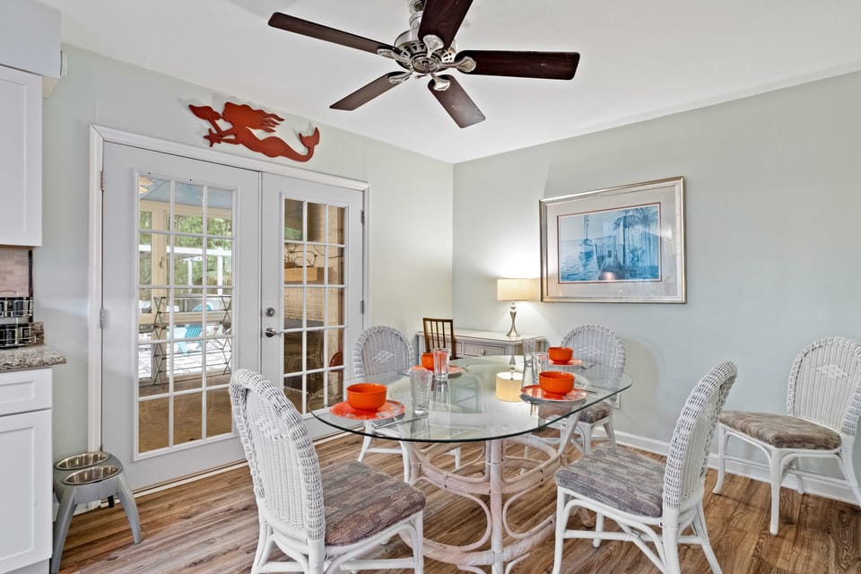 Dining area from Kitchen with doors to Screened Porch (best room in the house)