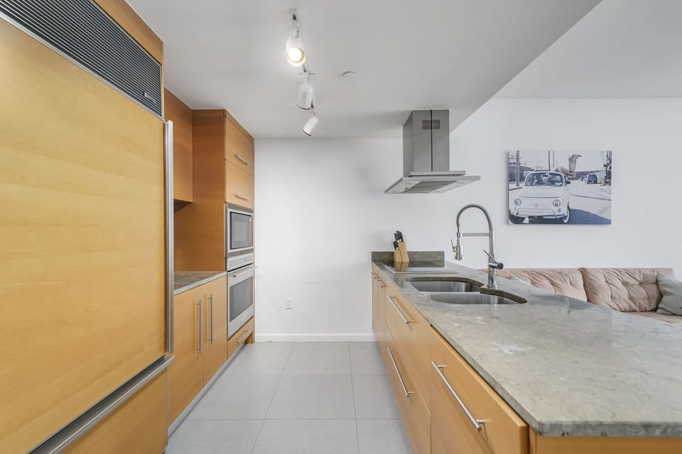 The kitchen is on your left side upon the entrance. 