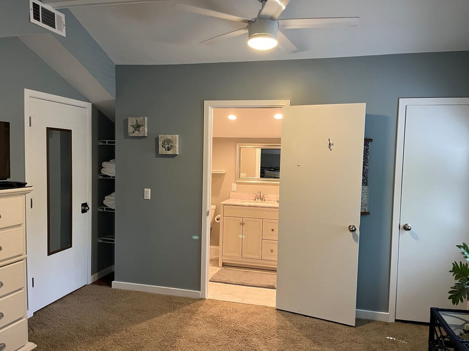 Second floor bedroom with two full size beds and private bathroom 