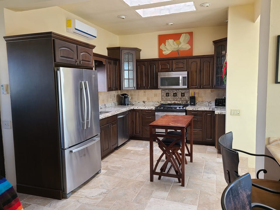 Open kitchen. Dishwasher.
     Seats 2 at the island