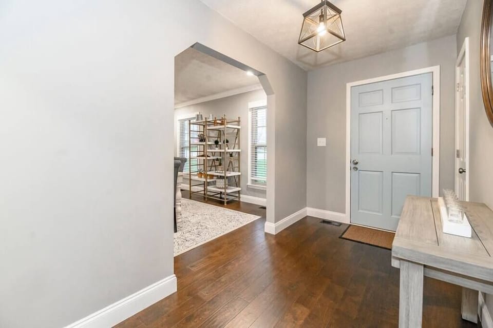 Step through the welcoming front door into a beautifully designed home that blends warmth and modern charm, letting the tone for a comfortable and memorable stay from the moment you arrive.