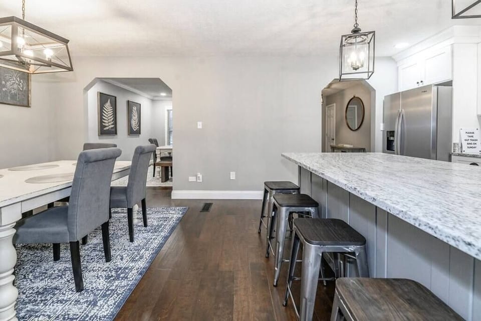 The dining room invites connection, whether it’s a cozy breakfast, a family dinner, or a game night. Warm lighting and stylish touches create the perfect setting for memories that linger long after the meal.