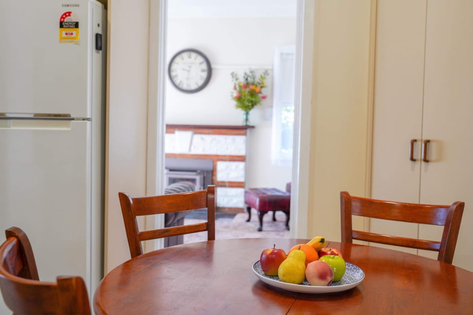 Kitchen featuring dining table, microwave and basic utensils & cookware.