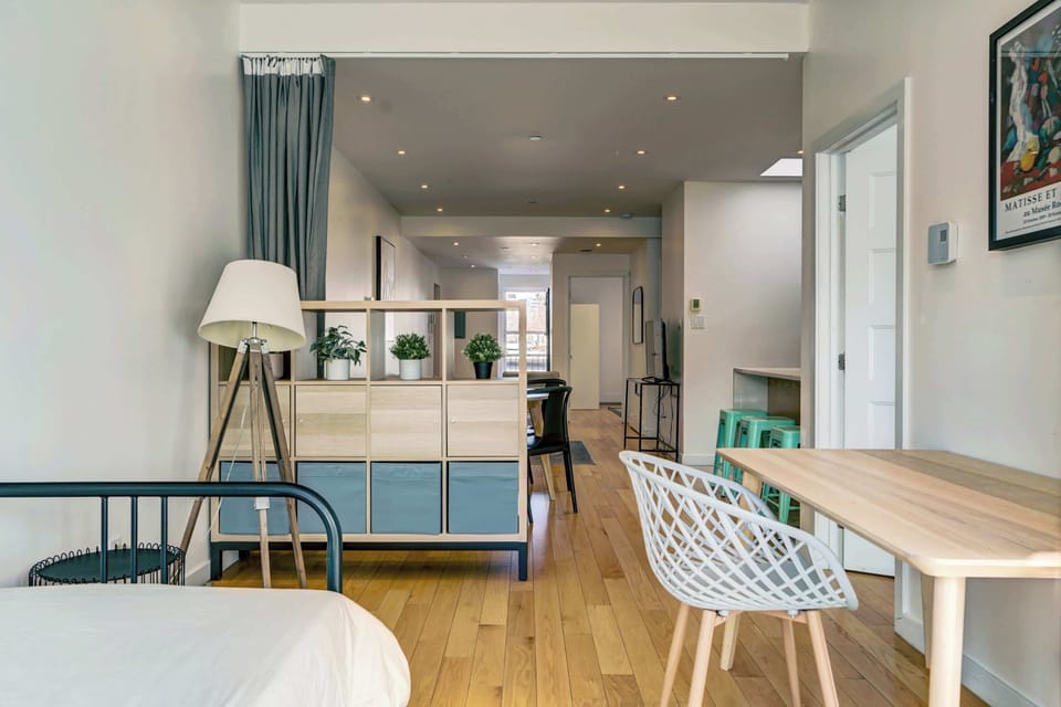 Open-concept living space with a defined bedroom area.