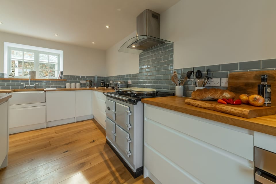 Barn Cottage, Salthouse: Well-equipped kitchen with Aga, Belfast sink and wine cooler