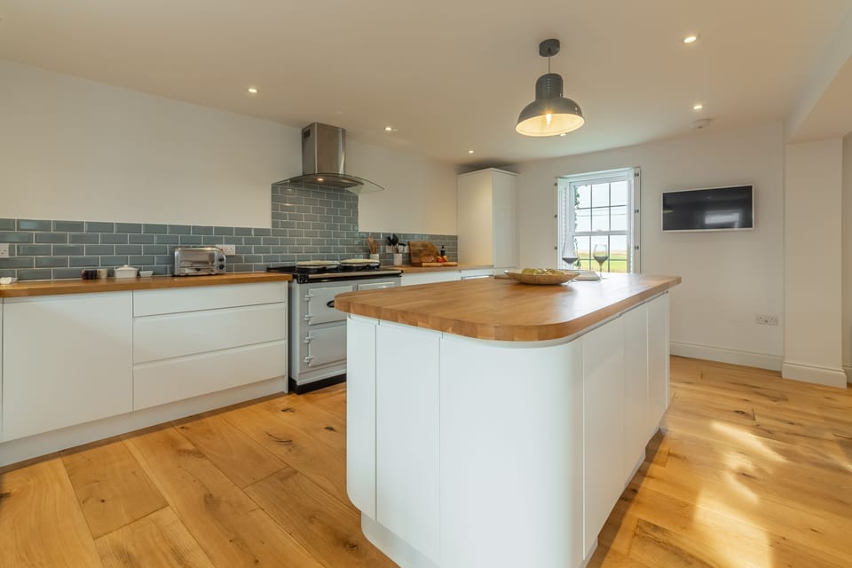 Ground floor: Kitchen with window overlooking the marshes to the sea