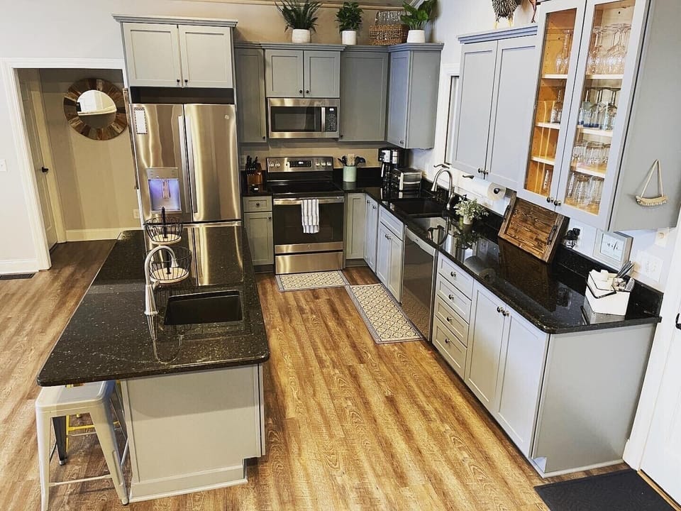 New refrigerator, glass top range, and microwave. 