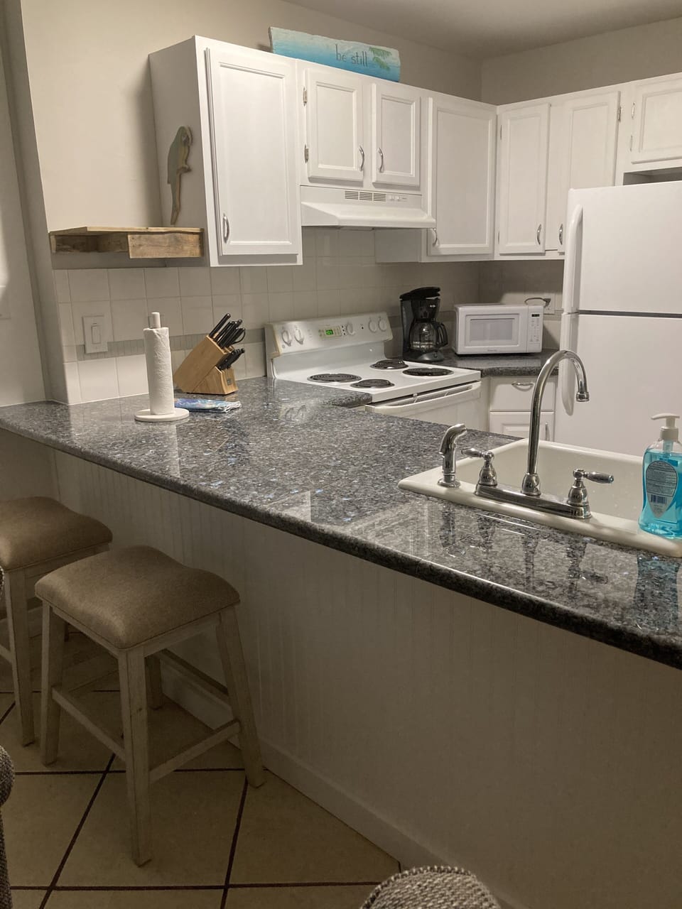 The kitchen has the appliances and housewares available for cooking.  