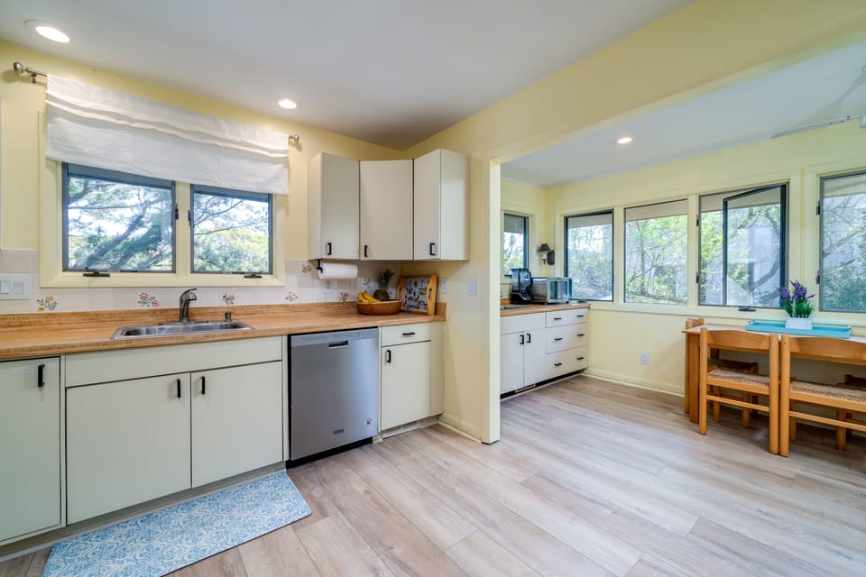 The kitchen opens onto a pantry area with second dining table. Great spot for breakfast, vacation craft projects, or the puzzle table.