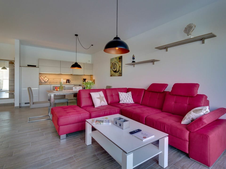 Living Room, Furniture, Room, Interior Design, Couch, Property, Floor, Pink, Coffee Table, Building