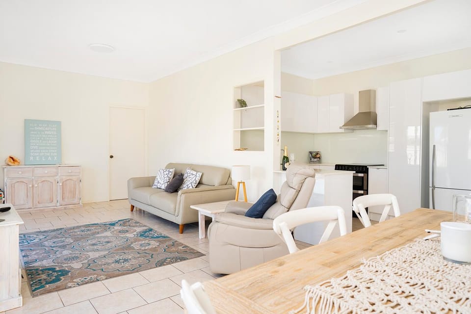 spacious and comfy TV room overlooks the pool with Air conditioning