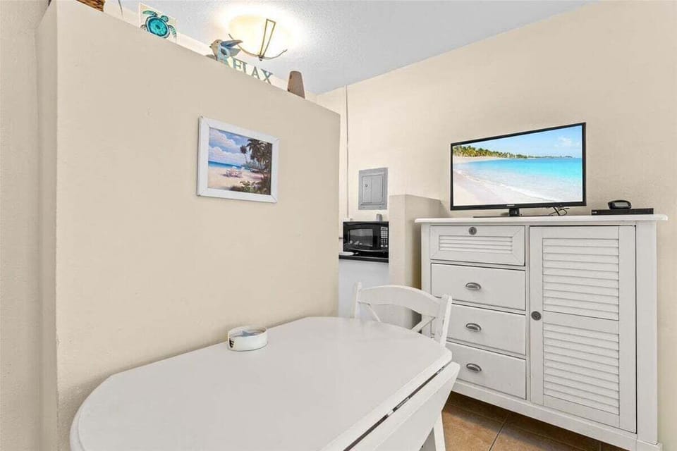 Compact kitchenette with a stove, fridge, microwave, coffee maker, and dedicated mini-split AC — everything you need for easy meals during your stay.