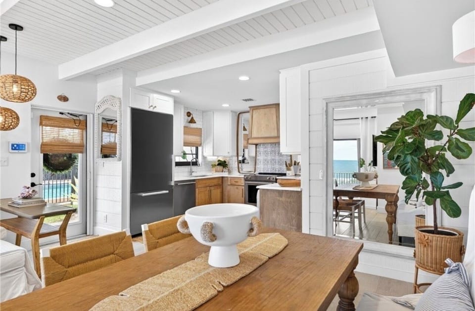 Coastal-chic kitchen with warm wood accents, modern finishes & ocean views.