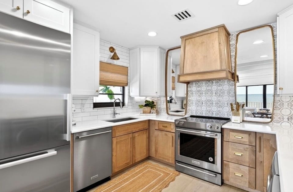 Coastal-chic kitchen with warm wood accents, modern finishes & ocean views.