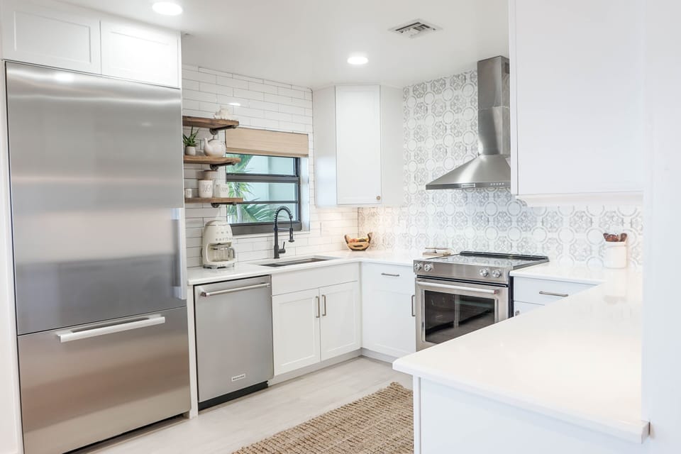 Kitchen featuring Miele Refrigerator and all new Kitchen Aid Appliances.
