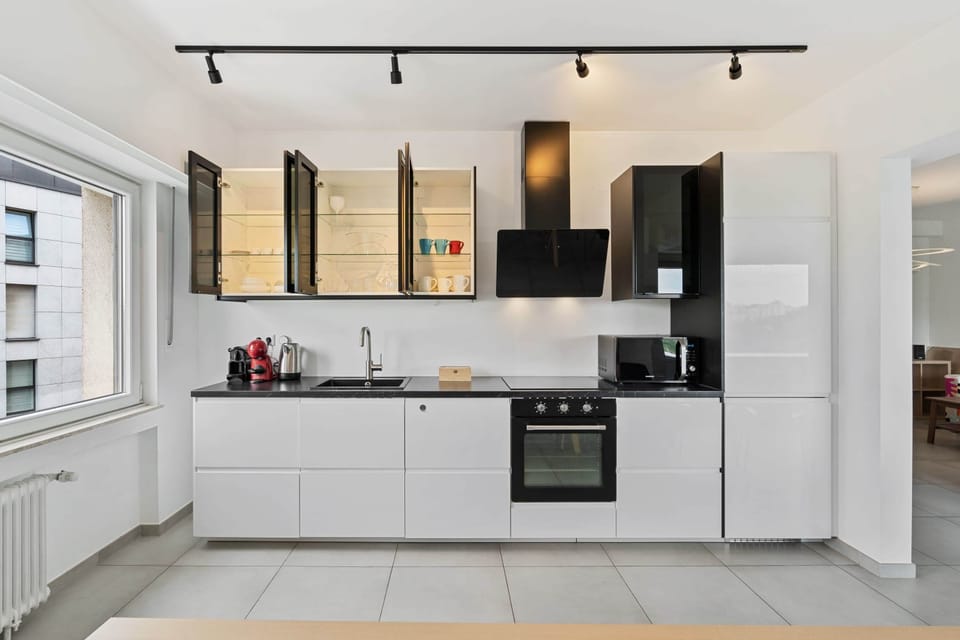 Sleek kitchen equipped with modern amenities to inspire your culinary flair.