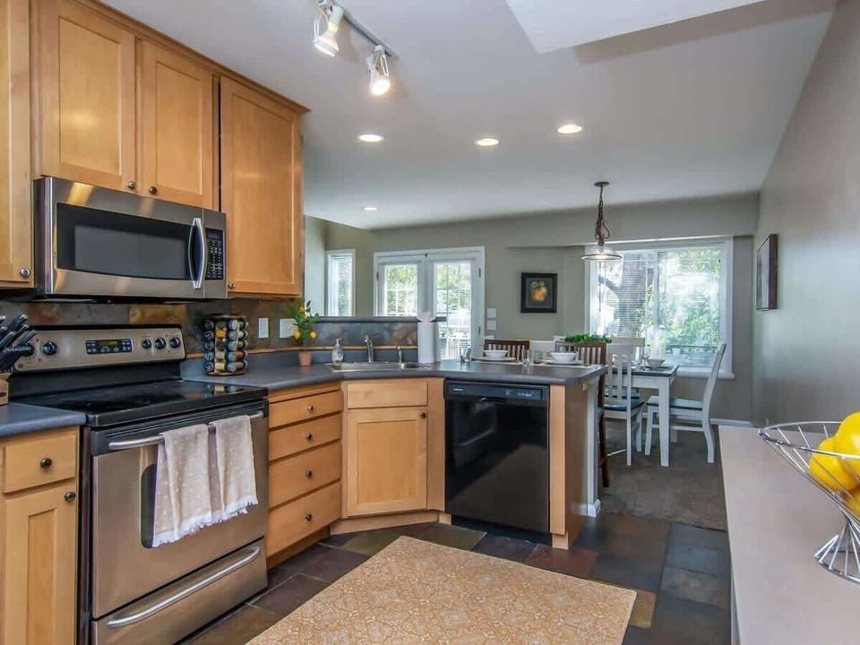 Beautiful open concept kitchen with dining area and bar