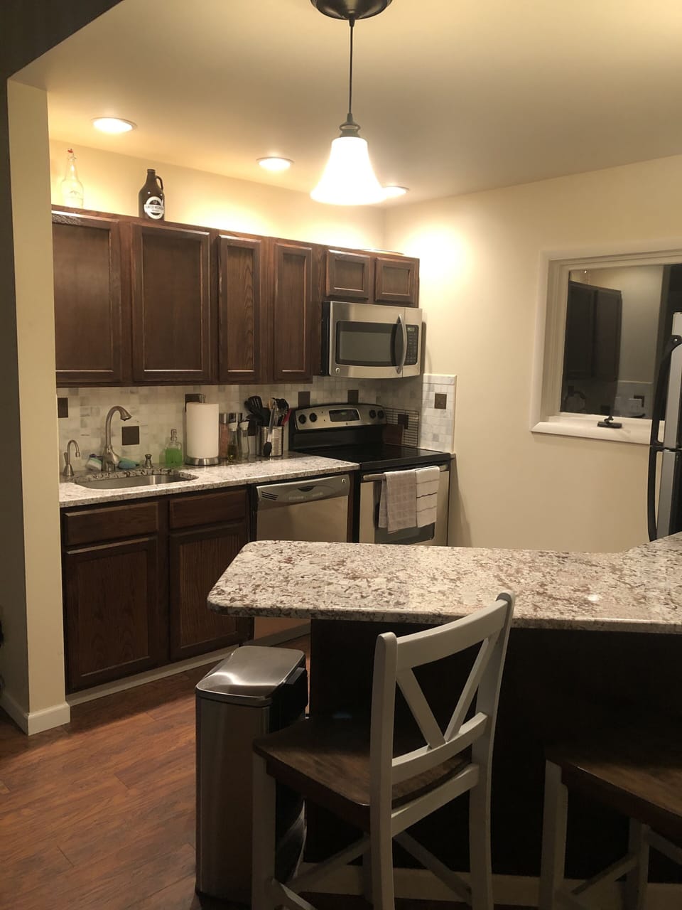 Updated stainless steel kitchen with granite breakfast bar