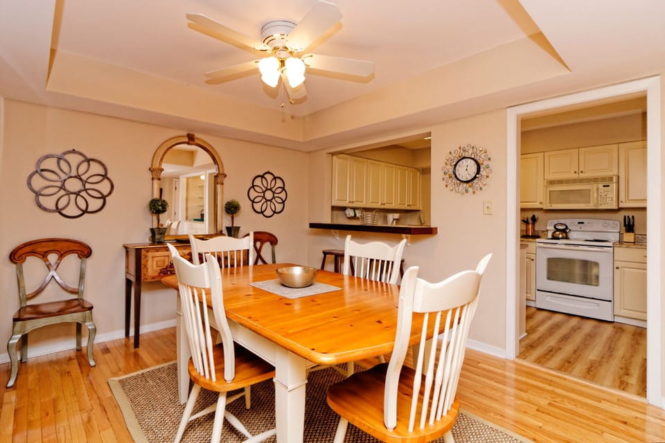 An open pass-through connects the dining area to the kitchen,