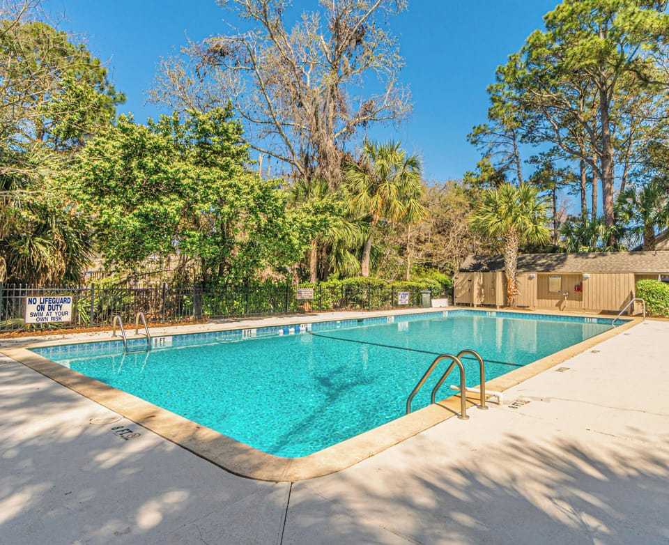 Surrounded by lush landscaping and convenient amenities, it's the perfect spot to unwind and enjoy island living just minutes from the home.