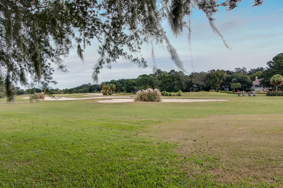 Mature trees and winding paths create a peaceful setting for golfers and walkers alike.