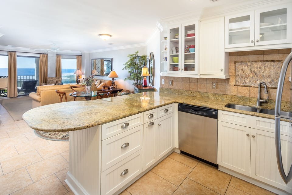 This open kitchen and breakfast bar create an easy, welcoming hub for everyday living and entertaining.